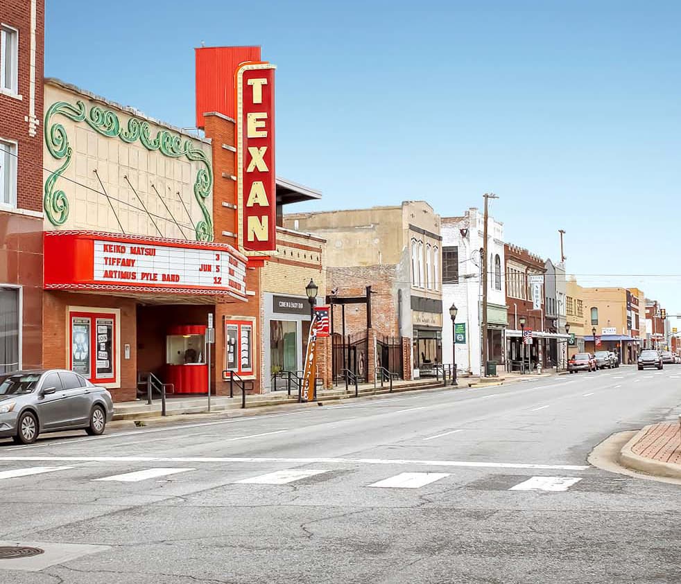 Crew members finishing a commercial concrete pour in Greenville, TX.