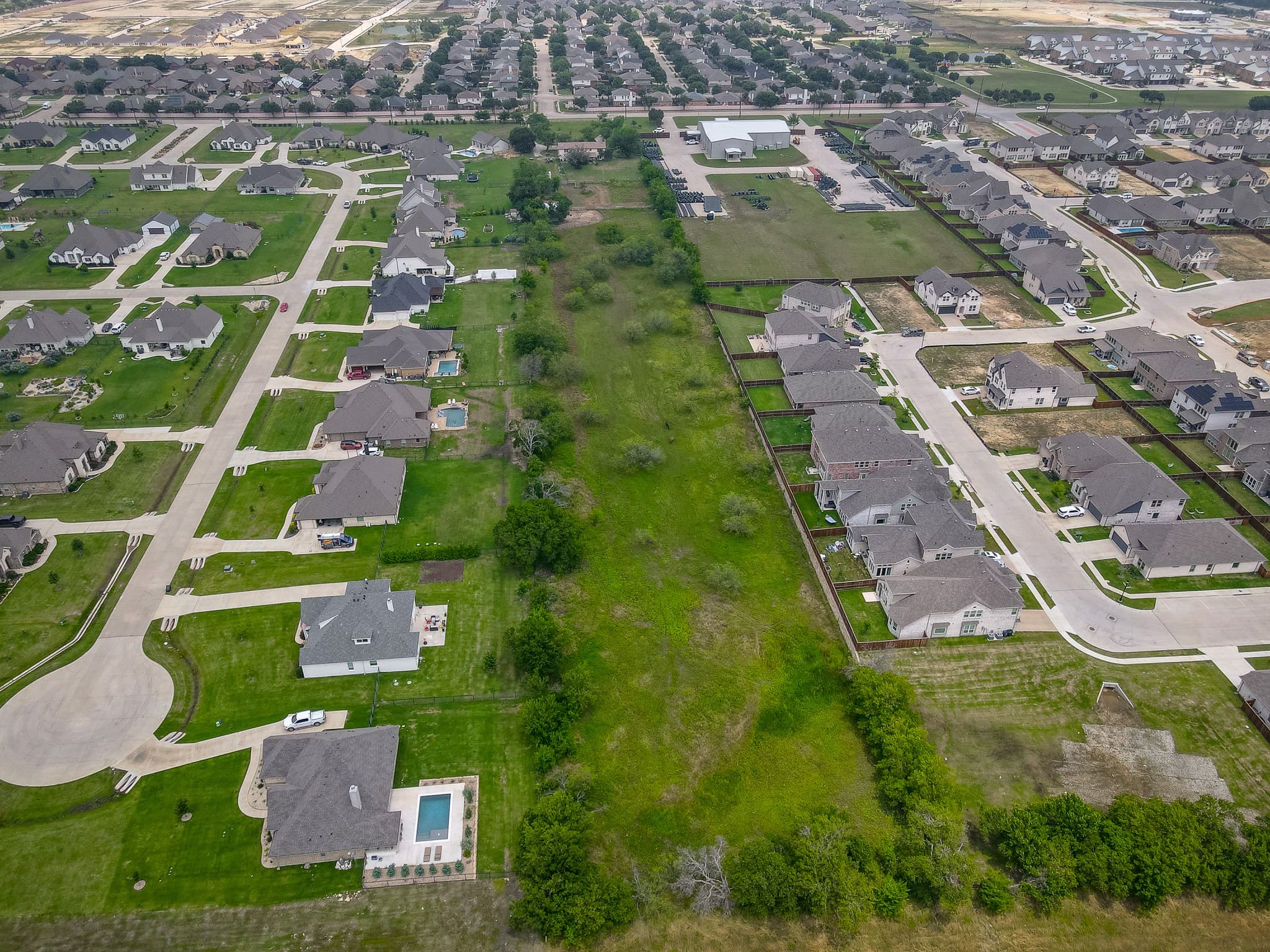 Crew members finishing a commercial concrete pour in Justin, TX.